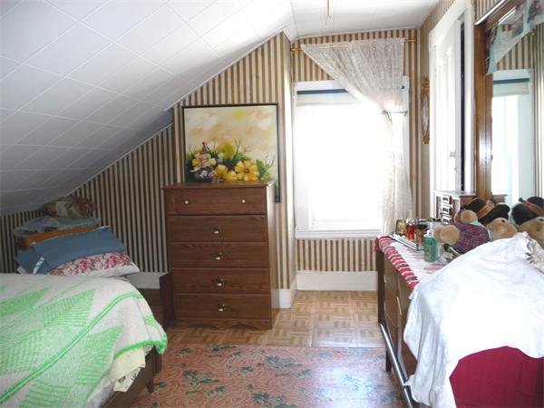 78 Spring Street Cambridge, MA 02141 - Photo 11 of 23 a bedroom with a bed and a window