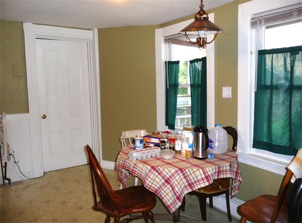 78 Spring Street Cambridge, MA 02141 - Photo 20 of 23 a dining room with a table chairs and a chandelier