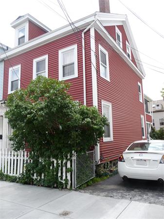 78 Spring Street Cambridge, MA 02141 - Photo 2 of 23 a front view of a house with a garden