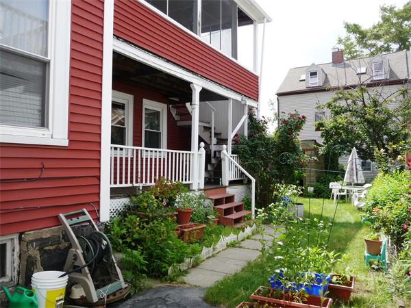 78 Spring Street Cambridge, MA 02141 - Photo 3 of 23 a front view of a house with garden