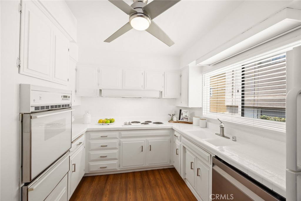 591 Fairview Avenue Arcadia, CA 91007 - Photo 7 of 20 a kitchen with white cabinets sink and white appliances