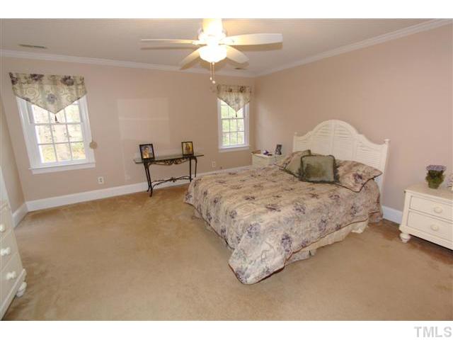 12016 Deer Run Raleigh, NC 27614 - Photo 11 of 23 a bedroom with a bed and a window