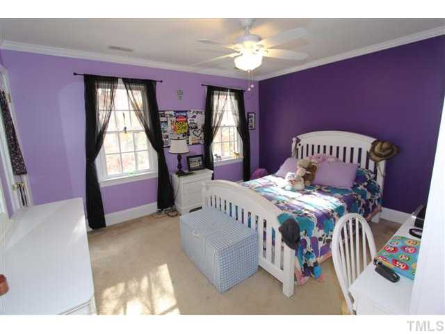 12016 Deer Run Raleigh, NC 27614 - Photo 14 of 23 a bedroom with a bed next to a window with outer view