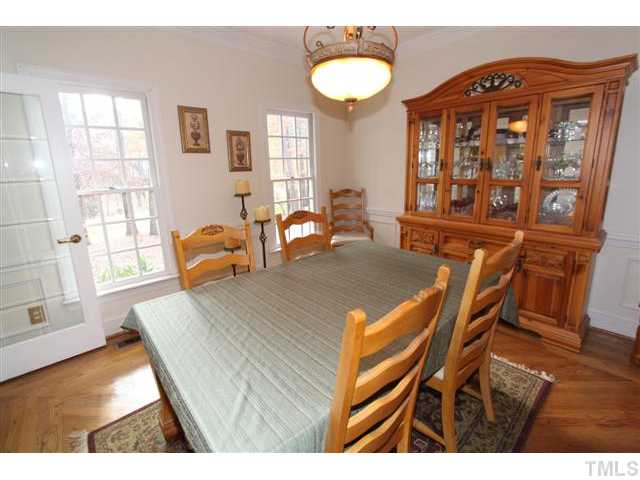 12016 Deer Run Raleigh, NC 27614 - Photo 3 of 23 a view of a dining room with furniture and wooden floor