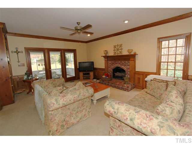 12016 Deer Run Raleigh, NC 27614 - Photo 4 of 23 a living room with furniture and a fireplace