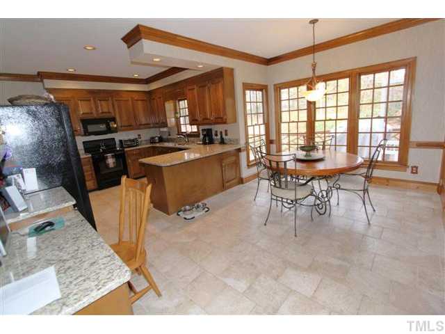 12016 Deer Run Raleigh, NC 27614 - Photo 6 of 23 a view of a kitchen and dining room