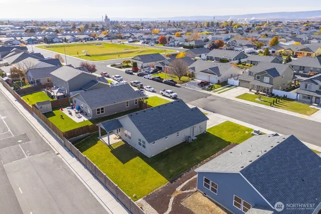 an aerial view of a house with a swimming pool