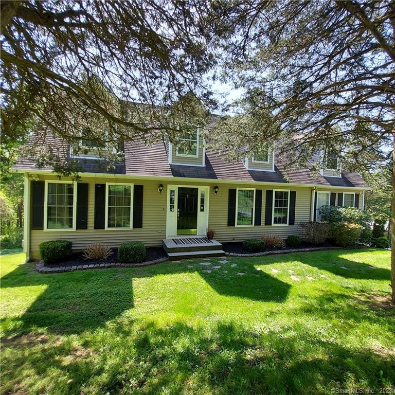 a view of a yard in front of a house