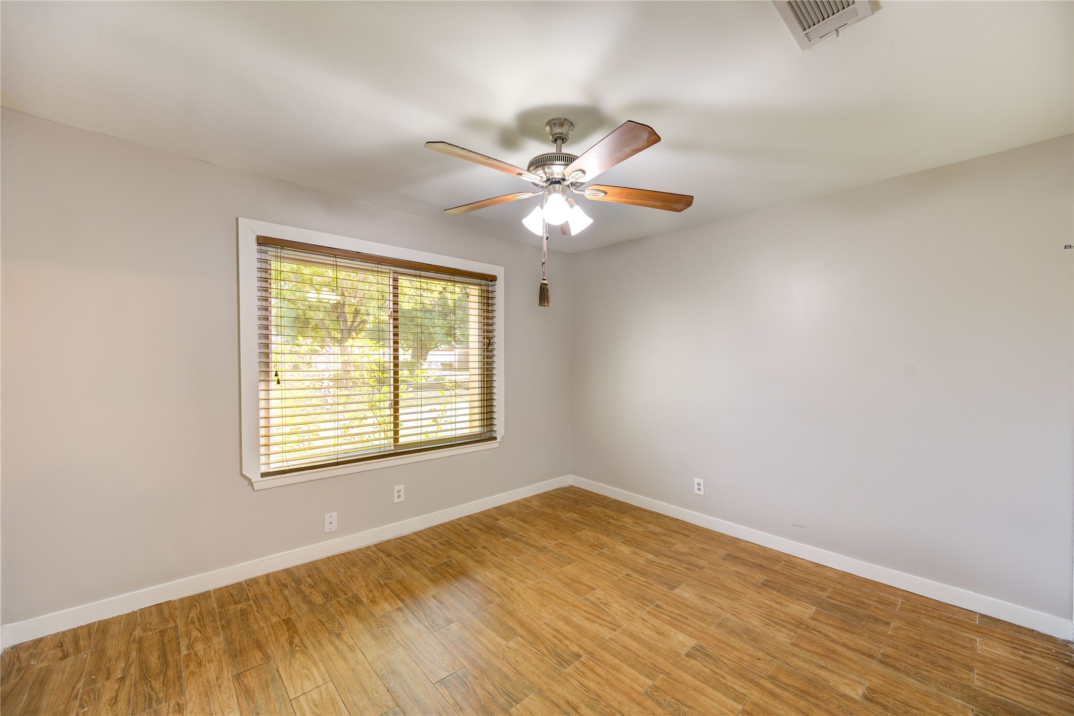 12339 South Dairy Ashford Road, Unit 2339 Houston, TX 77099 - Photo 11 of 19 a view of a room with a ceiling fan and a window