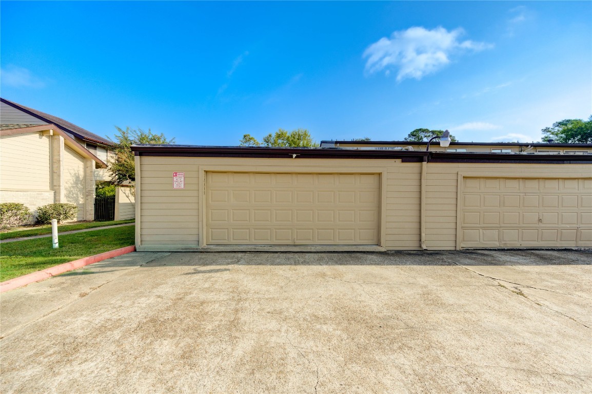 12339 South Dairy Ashford Road, Unit 2339 Houston, TX 77099 - Photo 18 of 19 Two car garage
