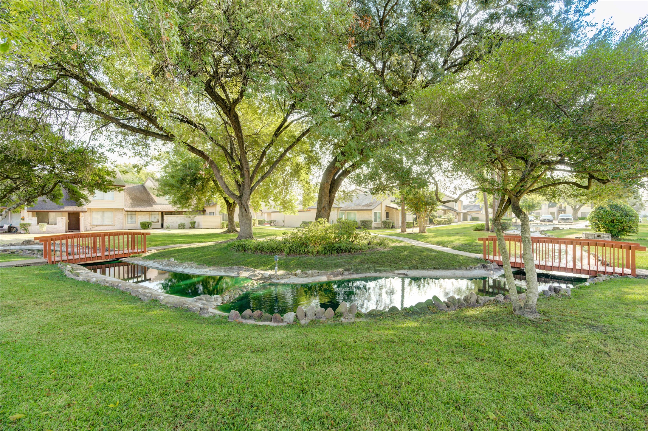 12339 South Dairy Ashford Road, Unit 2339 Houston, TX 77099 - Photo 2 of 19 a view of a park with large trees