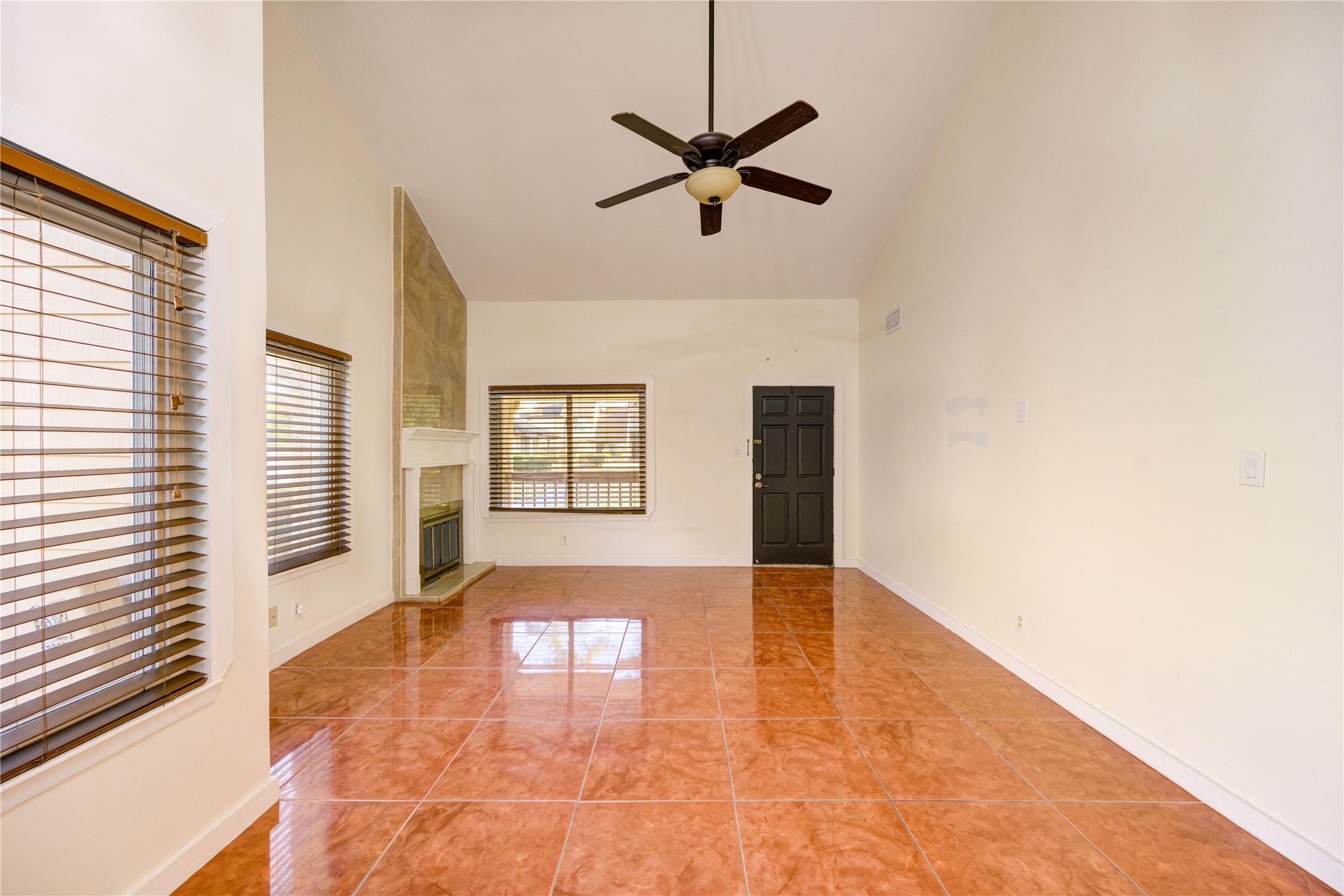 12339 South Dairy Ashford Road, Unit 2339 Houston, TX 77099 - Photo 4 of 19 a view of an empty room with a window and wooden floor
