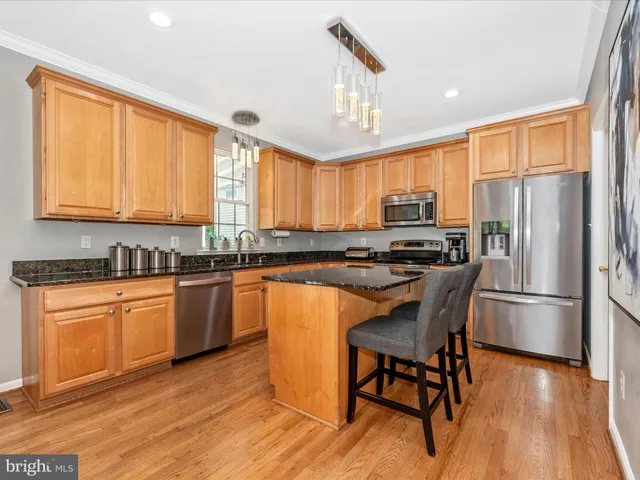 a kitchen with a stove and a sink