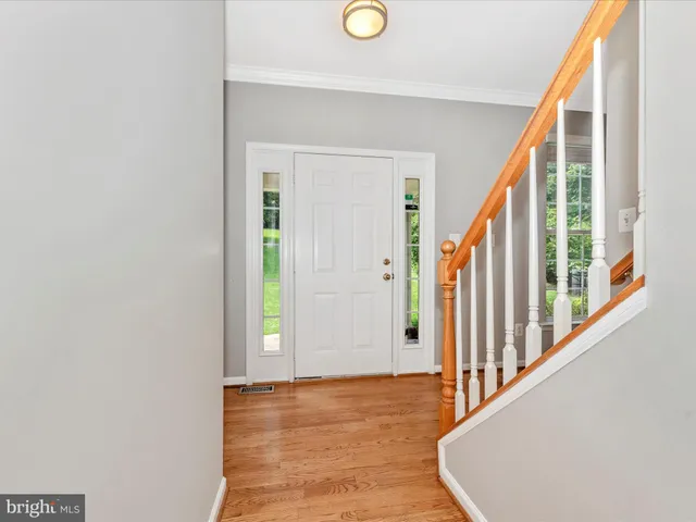 a spacious bathroom with a double vanity sink a mirror and a bathtub