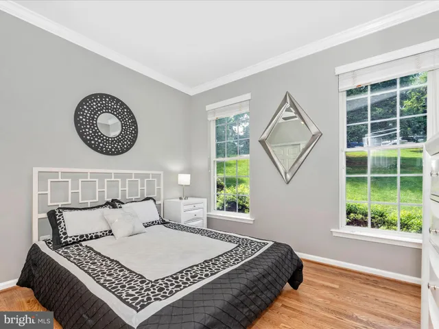 a bathroom with a tub shower and a window