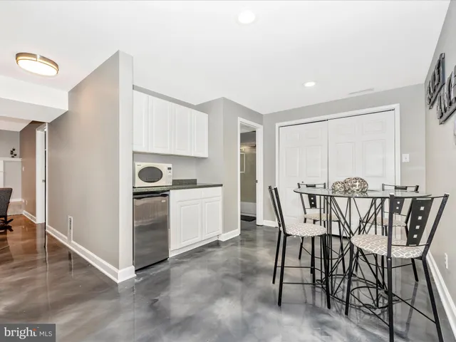 a view of a two chairs and table in the patio