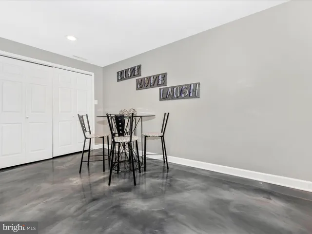 a view of a chair and table in the balcony