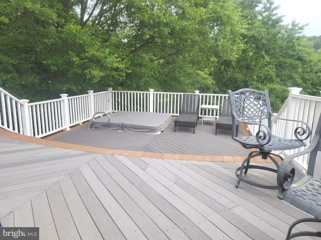 a living room with furniture windows and wooden floor