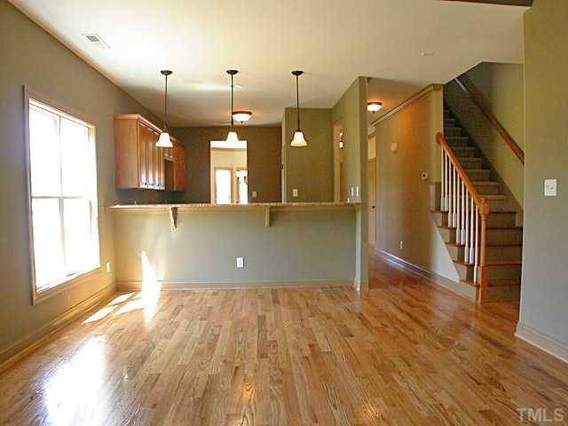 4626 Pat Reed Road Raleigh, NC 27616 - Photo 4 of 20 a view of a room with wooden floor and staircase