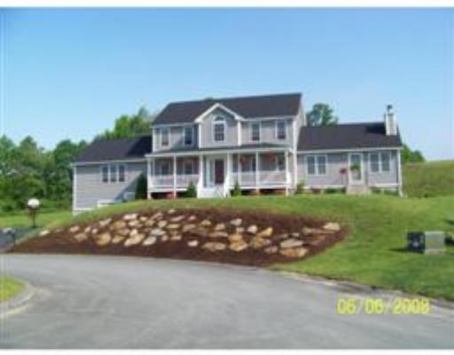 24 Jackson Avenue Rutland, MA 01543 - Photo 1 of 1 a front view of a house with a garden