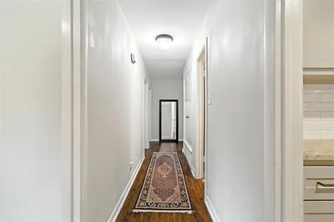a view of a hallway with front door