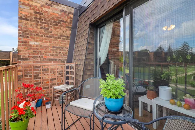 a view of a chairs and table in a patio