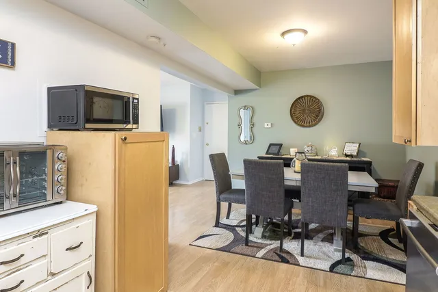 a living room with furniture a flat screen tv and a window