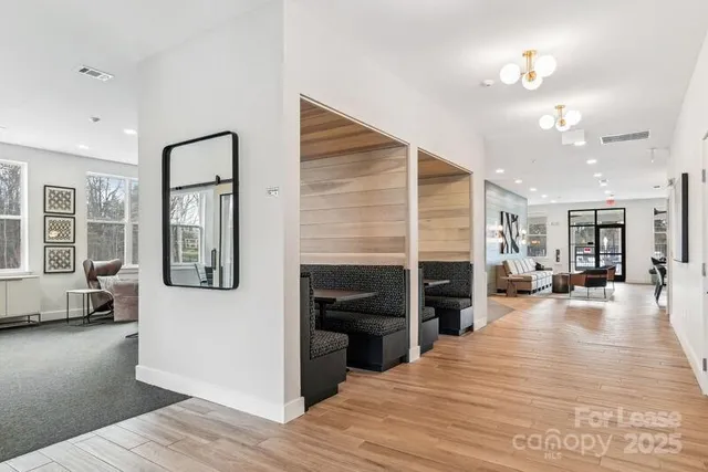 a view of a living room with furniture and a fireplace
