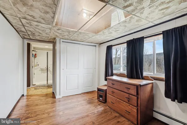 a room with furniture and large windows