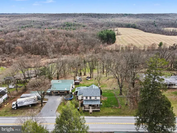 an aerial view of a house with a garden