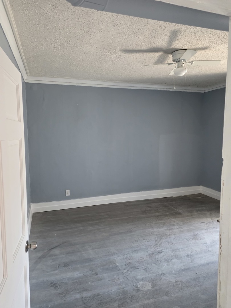 1853 East 79th Street, Unit 2 Chicago, IL 60649 - Photo 9 of 14 a view of an empty room