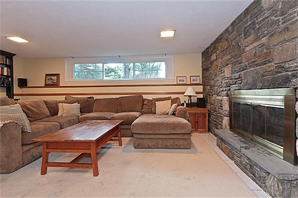 2 Wickham Road Winchester, MA 01890 - Photo 12 of 16 a living room with furniture and a fireplace