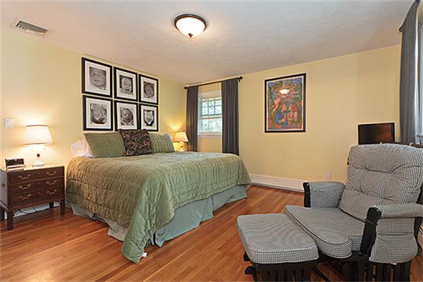 2 Wickham Road Winchester, MA 01890 - Photo 13 of 16 a bedroom with a bed and wooden floor
