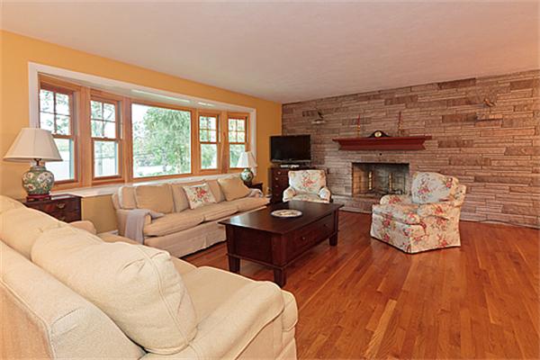 2 Wickham Road Winchester, MA 01890 - Photo 7 of 16 a living room with furniture and a fireplace