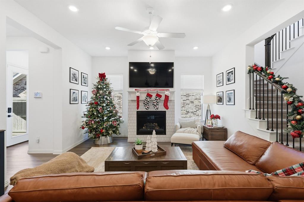 2331 Jack Rabbit Way Northlake, TX 76247 - Photo 12 of 38 a living room with furniture a flat screen tv and a fireplace