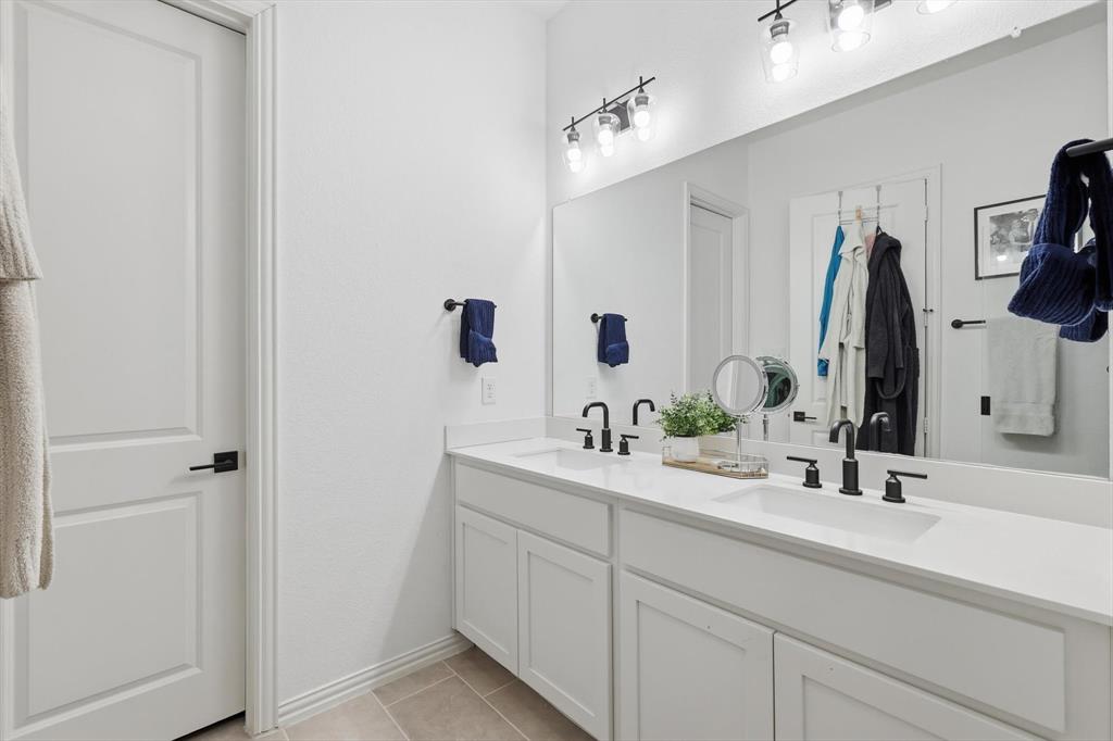 2331 Jack Rabbit Way Northlake, TX 76247 - Photo 20 of 39 a bathroom with double vanity sink and a mirror