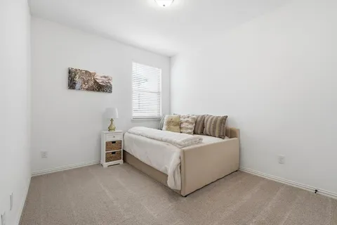 a room with a bed and a window