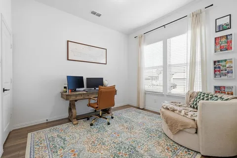 a work room with furniture and a window