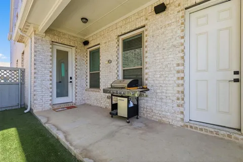 a view of a backyard with potted plants