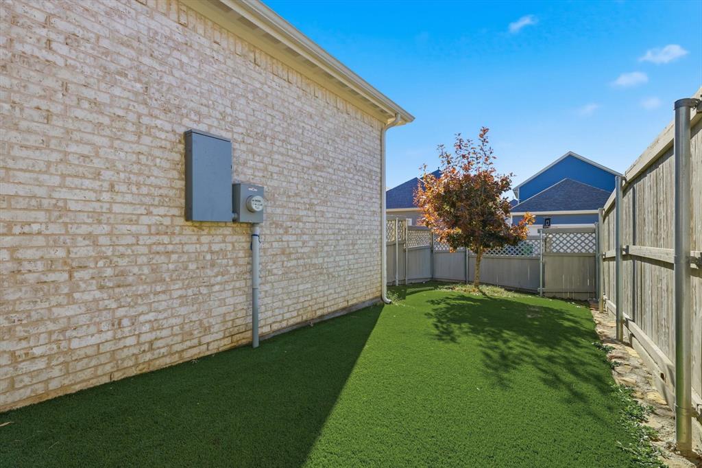 2331 Jack Rabbit Way Northlake, TX 76247 - Photo 29 of 38 a view of a backyard with potted plants