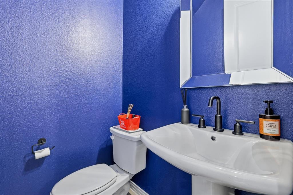 2331 Jack Rabbit Way Northlake, TX 76247 - Photo 9 of 39 a bathroom with a sink and a toilet