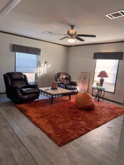 6218 Cr-4813 Pecan Gap, TX 75469 - Photo 12 of 30 Living room with wood finished floors, visible vents, and ceiling fan