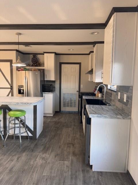6218 Cr-4813 Pecan Gap, TX 75469 - Photo 14 of 30 Kitchen with white cabinetry, fridge, extractor fan, and light countertops
