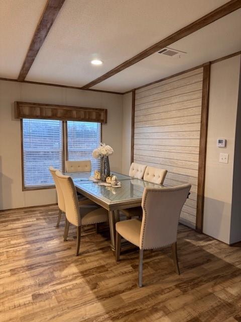 6218 Cr-4813 Pecan Gap, TX 75469 - Photo 30 of 30 Dining room featuring beamed ceiling, a textured ceiling, visible vents, and wood finished floors
