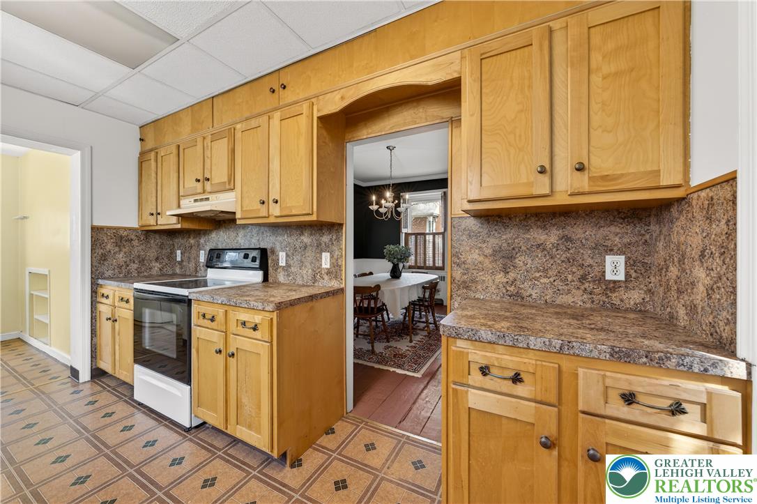 945 Main Street Bethlehem, PA 18018 - Photo 16 of 75 a kitchen with granite countertop cabinets stainless steel appliances and a counter space