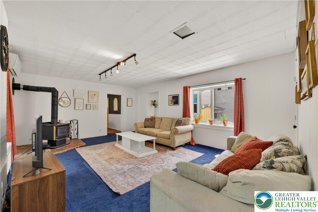 945 Main Street Bethlehem, PA 18018 - Photo 28 of 75 a living room with furniture and a flat screen tv