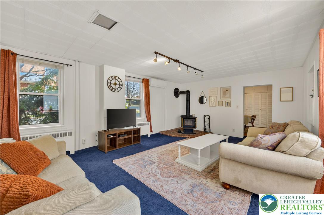 945 Main Street Bethlehem, PA 18018 - Photo 29 of 75 a living room with furniture and a flat screen tv