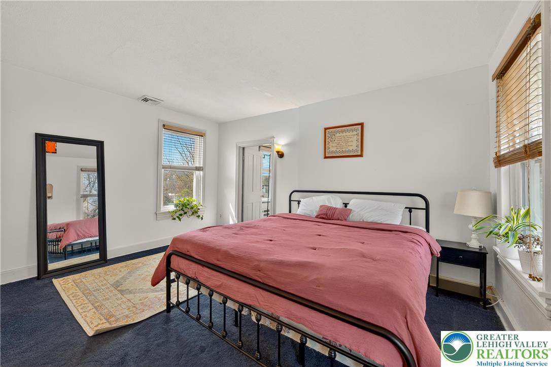 945 Main Street Bethlehem, PA 18018 - Photo 35 of 75 a bedroom with a bed a dresser and next to a window