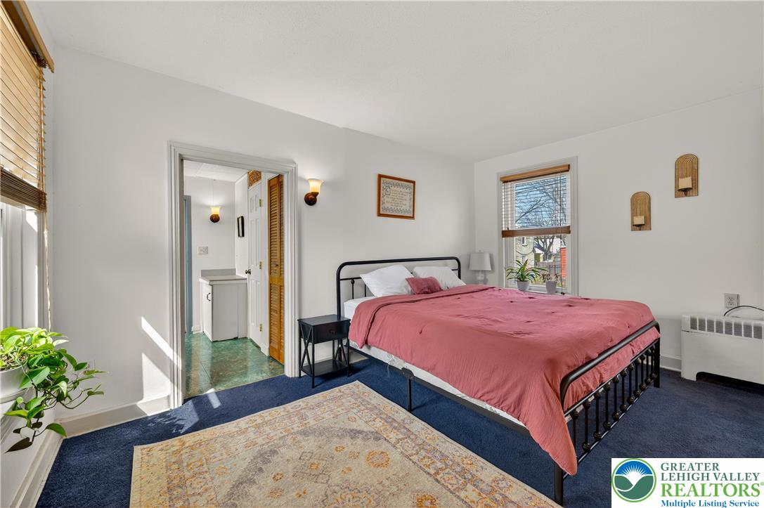 945 Main Street Bethlehem, PA 18018 - Photo 38 of 75 a bedroom with a bed and a potted plant