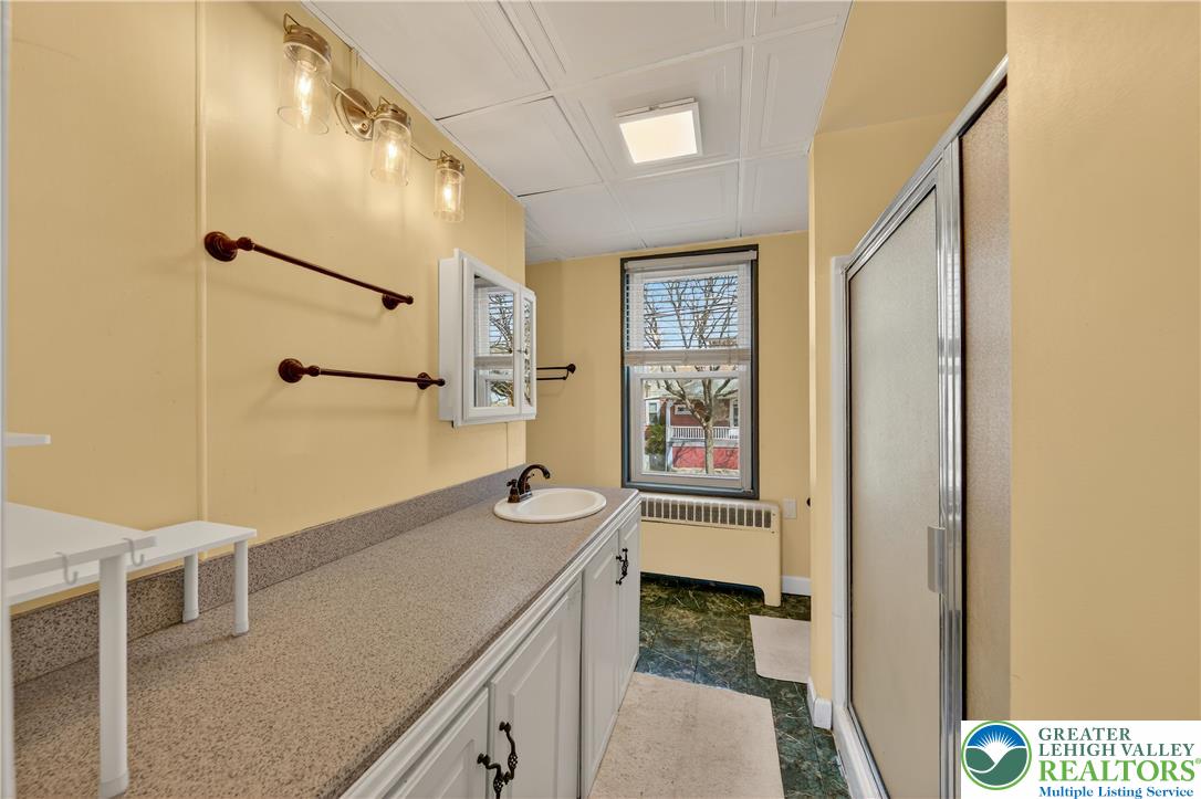 945 Main Street Bethlehem, PA 18018 - Photo 39 of 75 a bathroom with a sink a toilet and shower